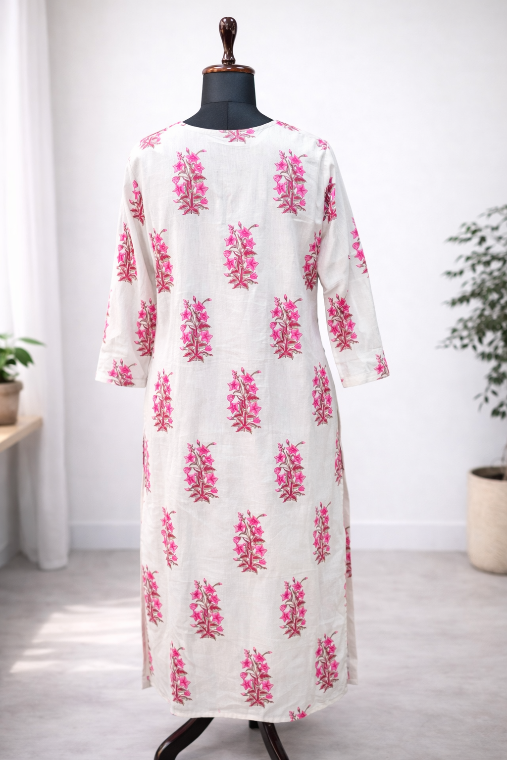 Jeenas white kurta with pink floral motifs